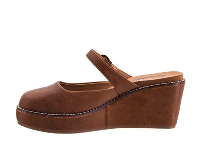 A brown faux-leather wedge mule sandal with a Mary Jane strap, shown in a side profile view against a plain white background.