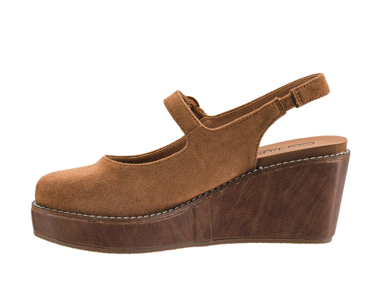 A brown suede Mary Jane wedge sandal with an adjustable ankle strap, shown from a side profile view against a white background.