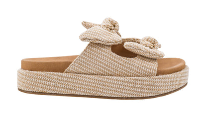Beige woven sandal with a platform sole on a white background